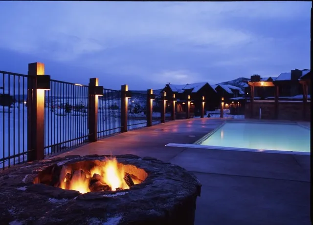 a view of a swimming pool with an outdoor seating