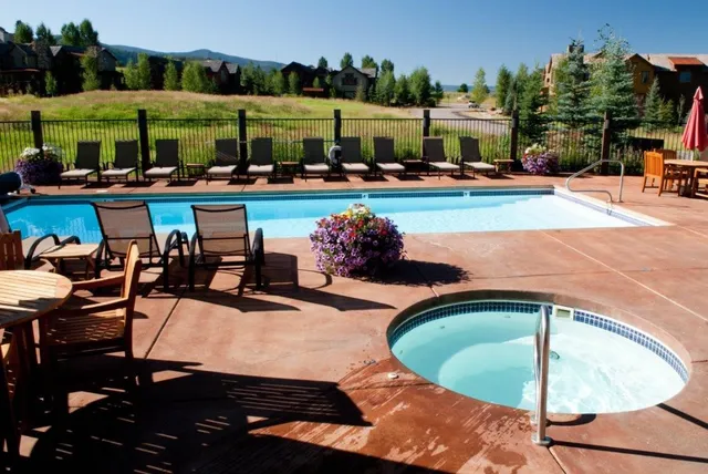 an outdoor space with seating area and outdoor seating