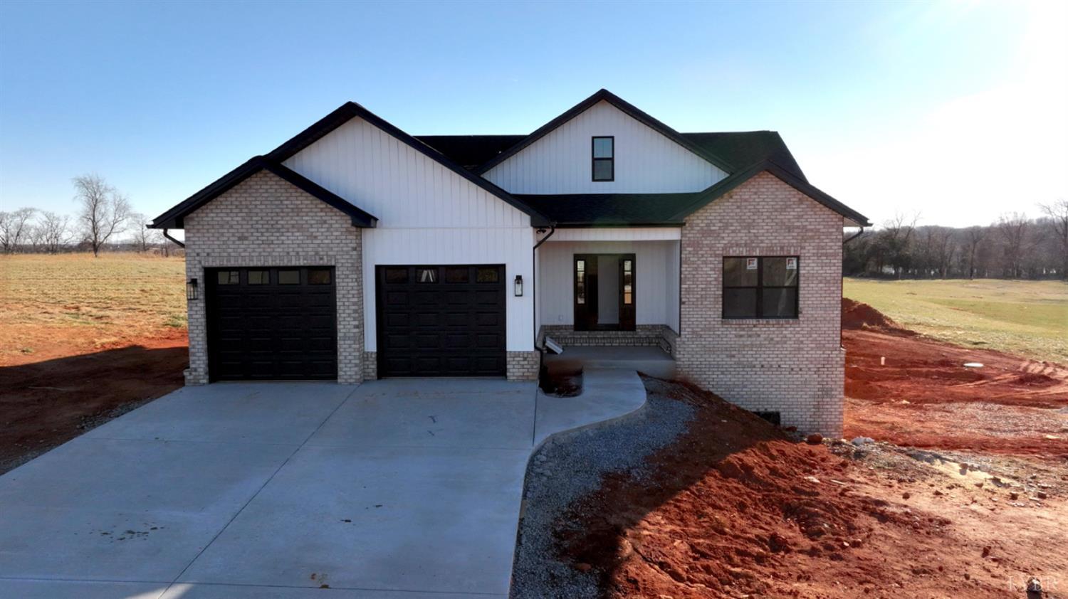 a front view of a house with outdoor space