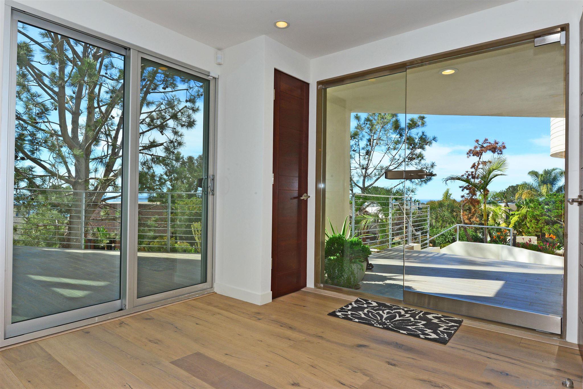 13721 Pine Needles Drive Del Mar, CA 92014 - Photo 6 of 32 a view of an entryway with garden
