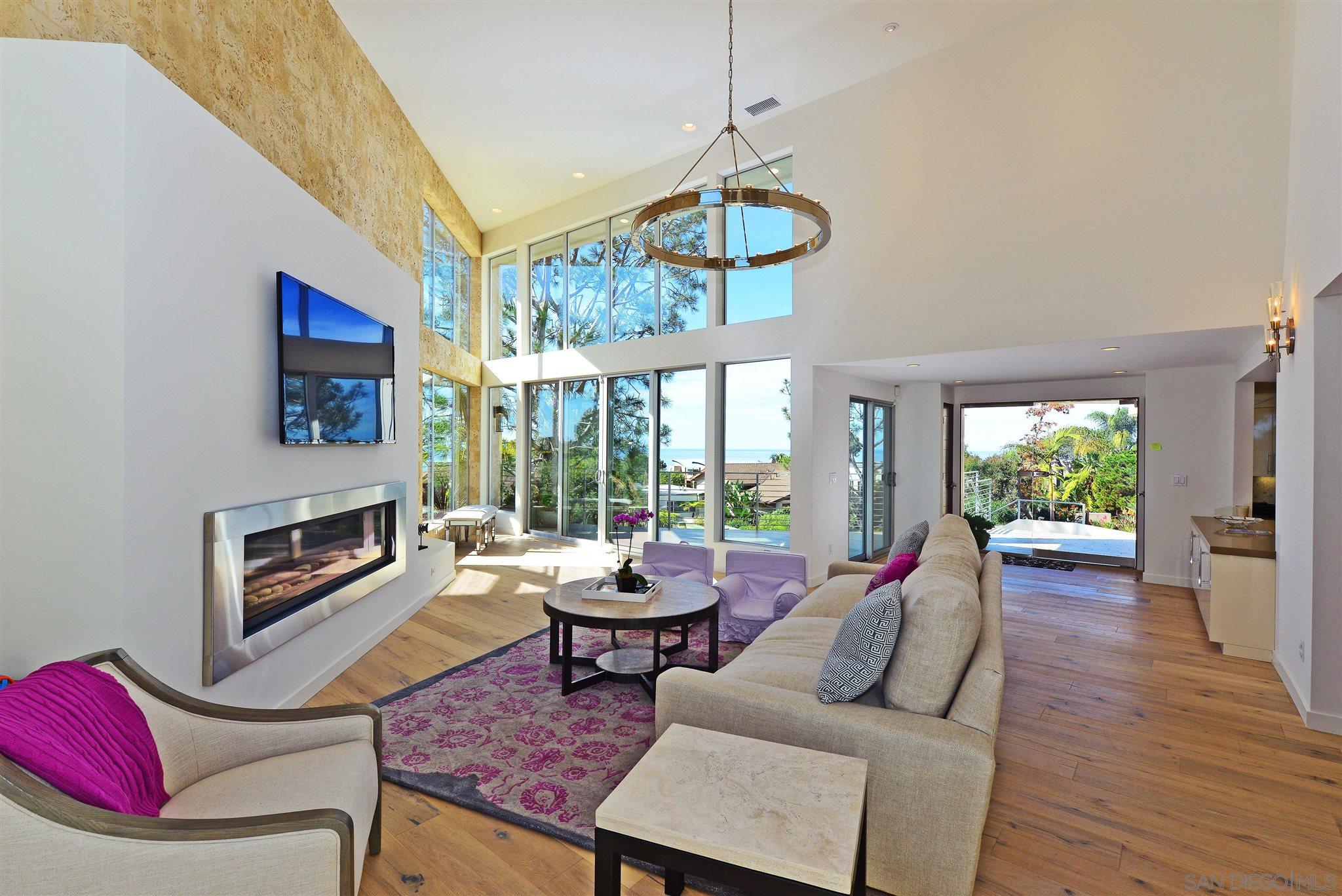 13721 Pine Needles Drive Del Mar, CA 92014 - Photo 7 of 32 a living room with fireplace furniture and a large window