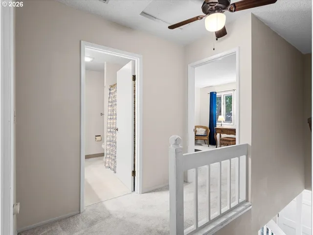 a bedroom with a bed and a table