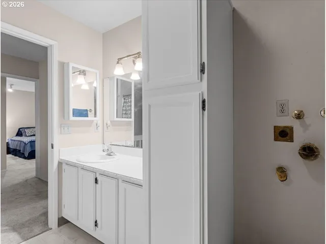 an empty room with furniture and a window