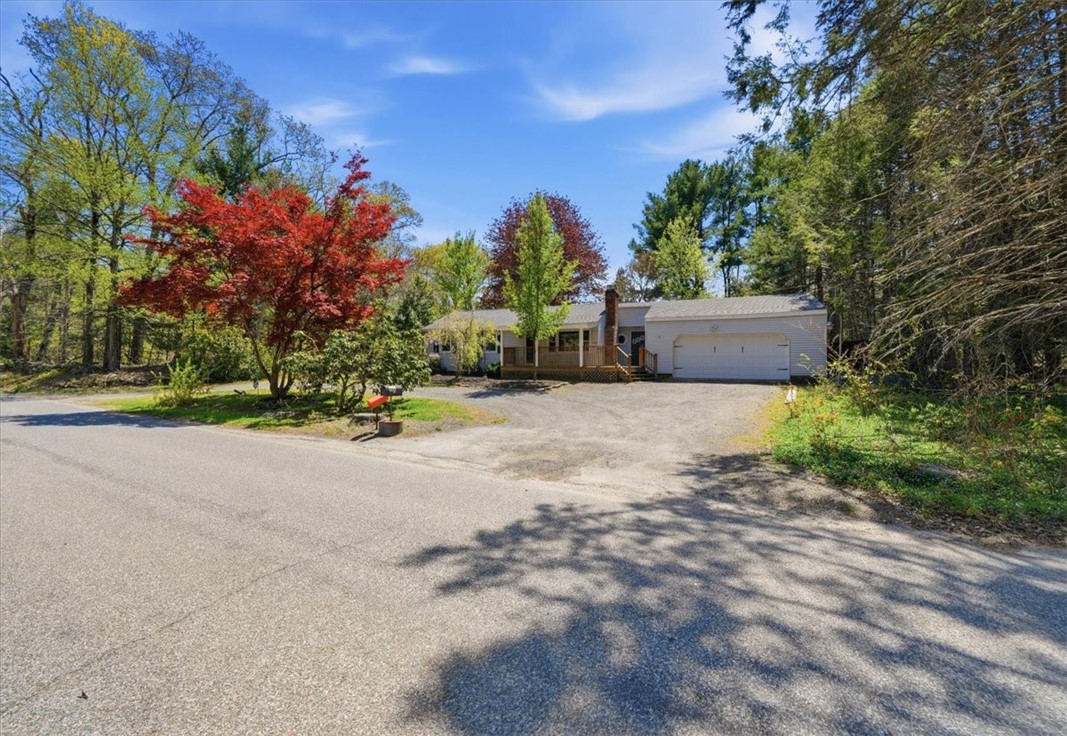 322 Rocky Hill Road Scituate, RI 02857 - Photo 3 of 50 Oversized 2-car garage offering exceptional space for vehicles, storage, and workshop potential. Huge driveway fits plenty of vehicles.