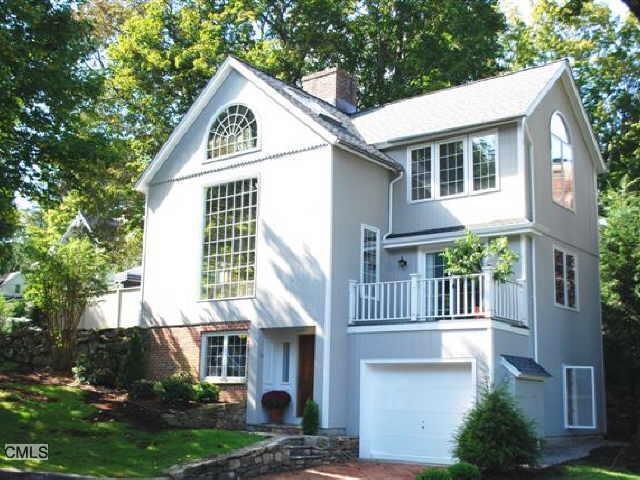 36 Catoonah Street, Unit 16 Ridgefield, CT 06877 - Photo 1 of 1 a front view of a house with garden