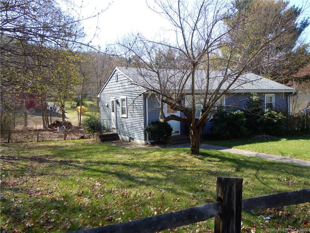 36 Carter Road Thomaston, CT 06787 - Photo 1 of 1 a front view of a house with garden