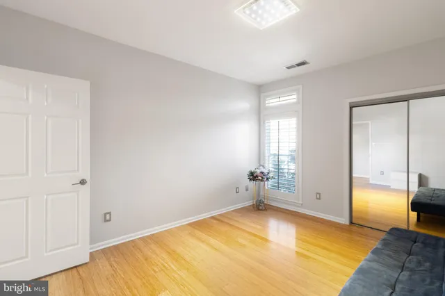 a view of a glass door with a small yard from a window