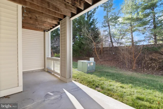a view of a swimming pool with a patio and a backyard