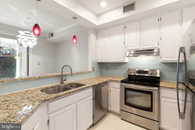 a view of a room with a bed