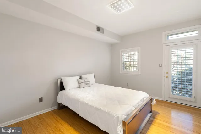 a living room with a couch and a window