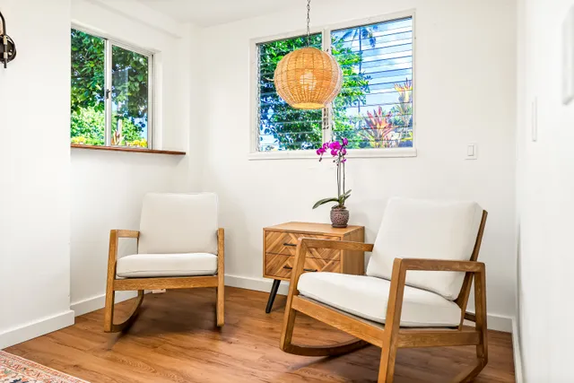 a view of a hallway view with wooden floor and windows