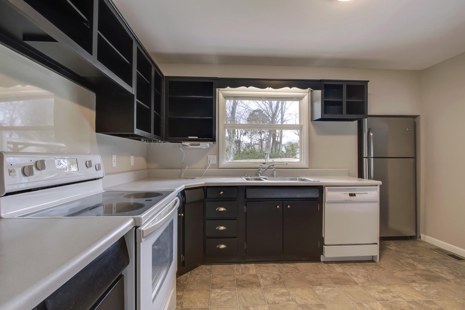 3109 Walnoaks Road Knoxville, TN 37921 - Photo 12 of 33 a kitchen with a sink stove and refrigerator