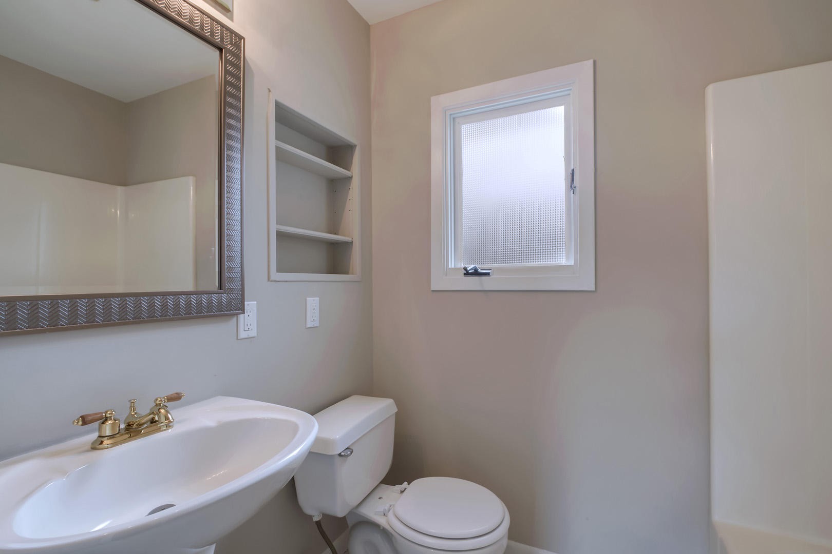 3109 Walnoaks Road Knoxville, TN 37921 - Photo 21 of 33 a white toilet sitting next to a bathroom sink