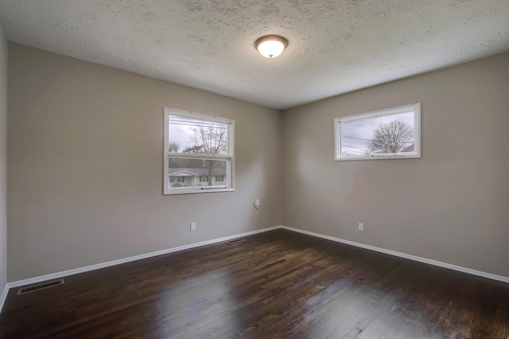 3109 Walnoaks Road Knoxville, TN 37921 - Photo 25 of 33 a view of an empty room with wooden floor and a window