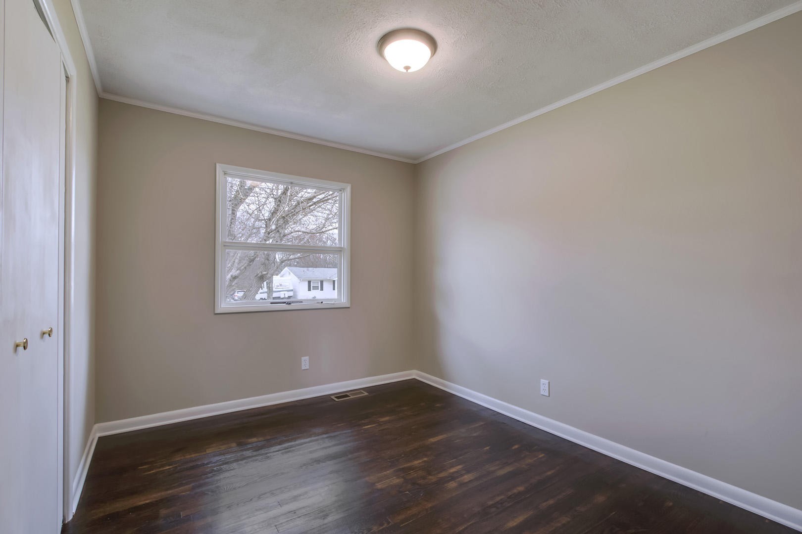 3109 Walnoaks Road Knoxville, TN 37921 - Photo 28 of 33 an empty room with wooden floor and windows