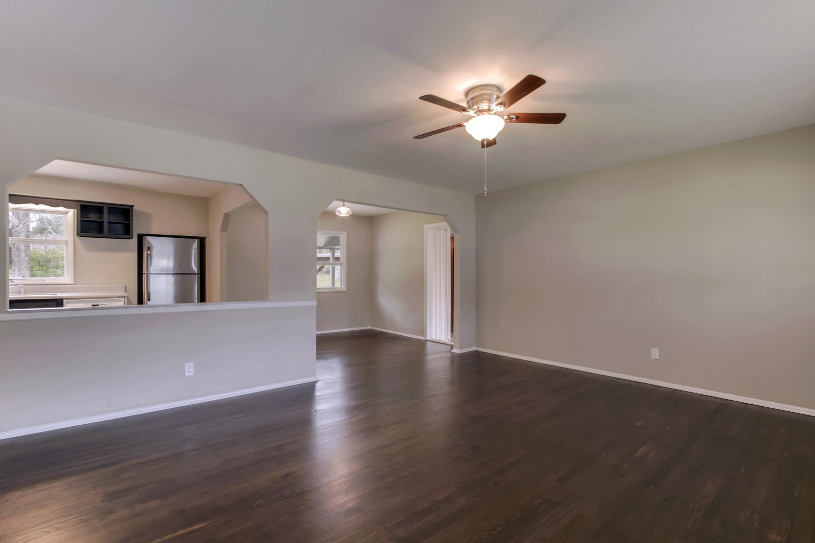 3109 Walnoaks Road Knoxville, TN 37921 - Photo 3 of 33 a view of a livingroom with a ceiling fan and wooden floor