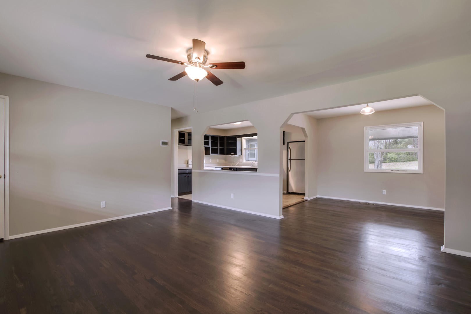 3109 Walnoaks Road Knoxville, TN 37921 - Photo 6 of 33 a view of an empty room with wooden floor and a window