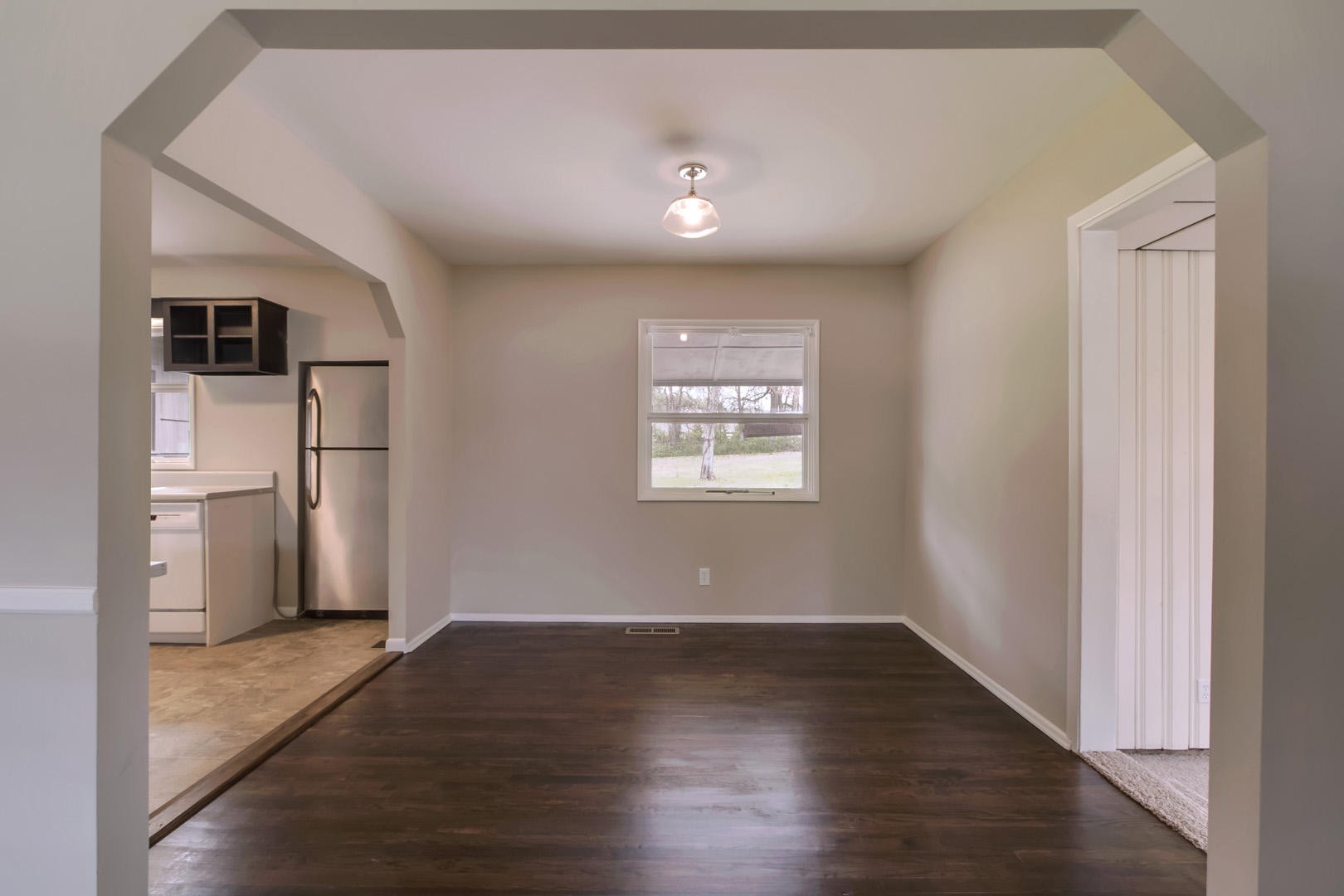 3109 Walnoaks Road Knoxville, TN 37921 - Photo 7 of 33 a view of empty room with wooden floor and refrigerator