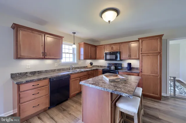 a living room with furniture window and a fireplace