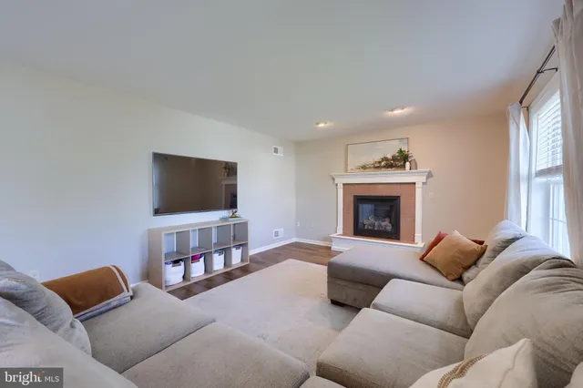 a bedroom with a bed and a chair