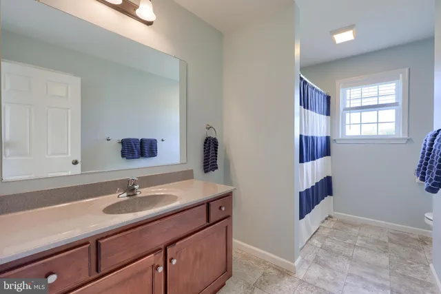 a view of a patio with a dining table and chairs with wooden floor