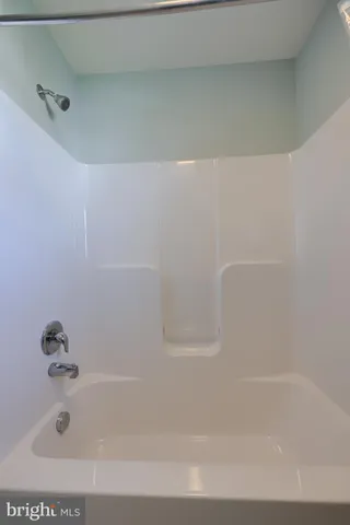 a view of a patio with table and chairs and wooden floor