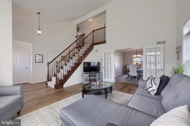 a kitchen with granite countertop a sink stove and refrigerator