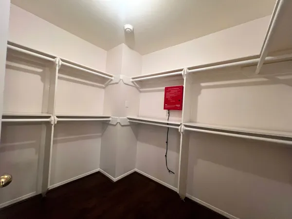 a view of an empty walk in closet