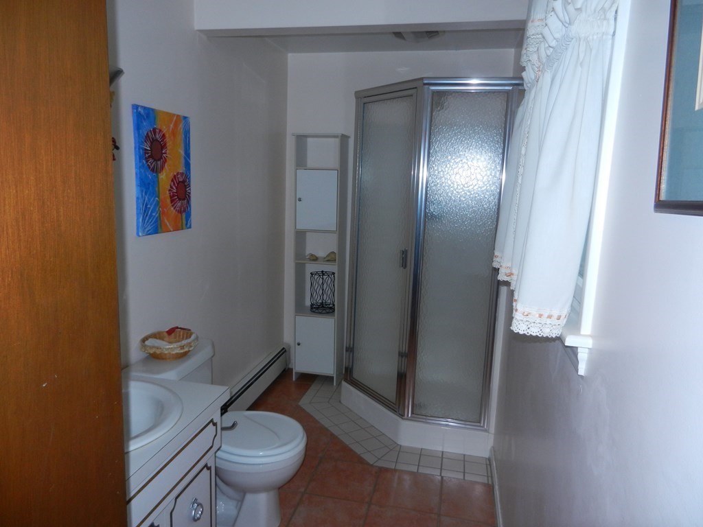 32 Intervale Road Waltham, MA 02453 - Photo 8 of 14 a bathroom with a toilet and a shower