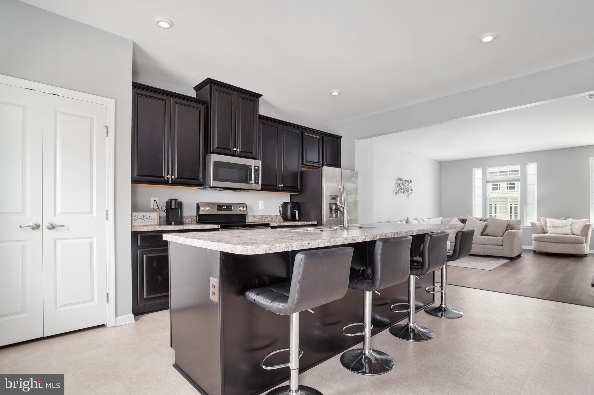 207 Rising Sun Road Fredericksburg, VA 22405 - Photo 7 of 24 Espresso cabinets and stainless steel appliances