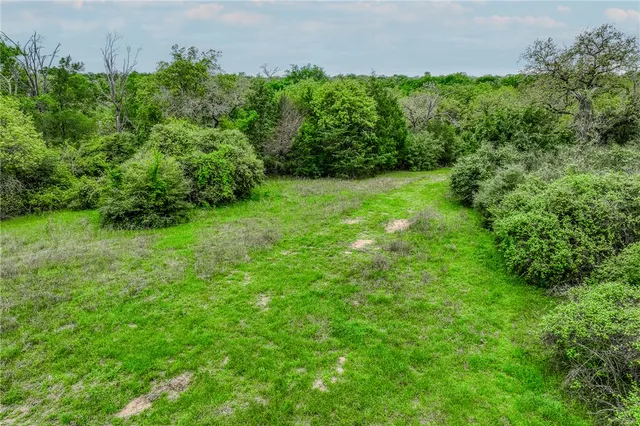 a view of a yard from a balcony