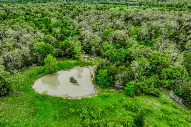 a backyard of a house with a yard and seating area