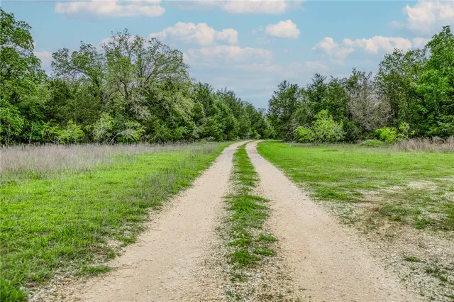 a view of a lake with a yard