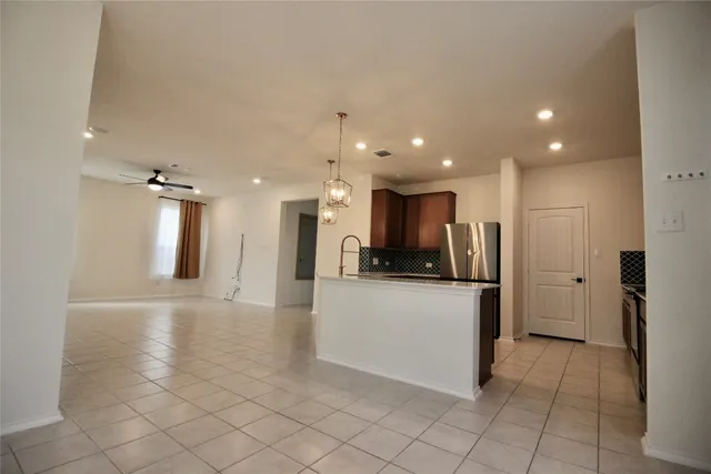 a very nice looking bedroom with a large window