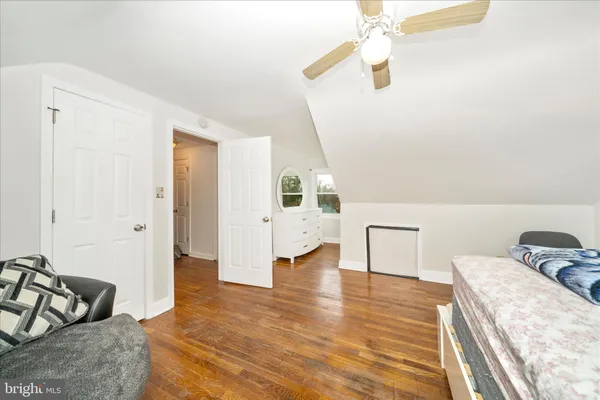 a bedroom with furniture and window