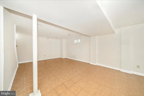 a view of a balcony with wooden floor and fence