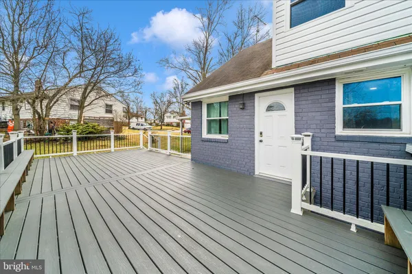 a view of a house with wooden deck