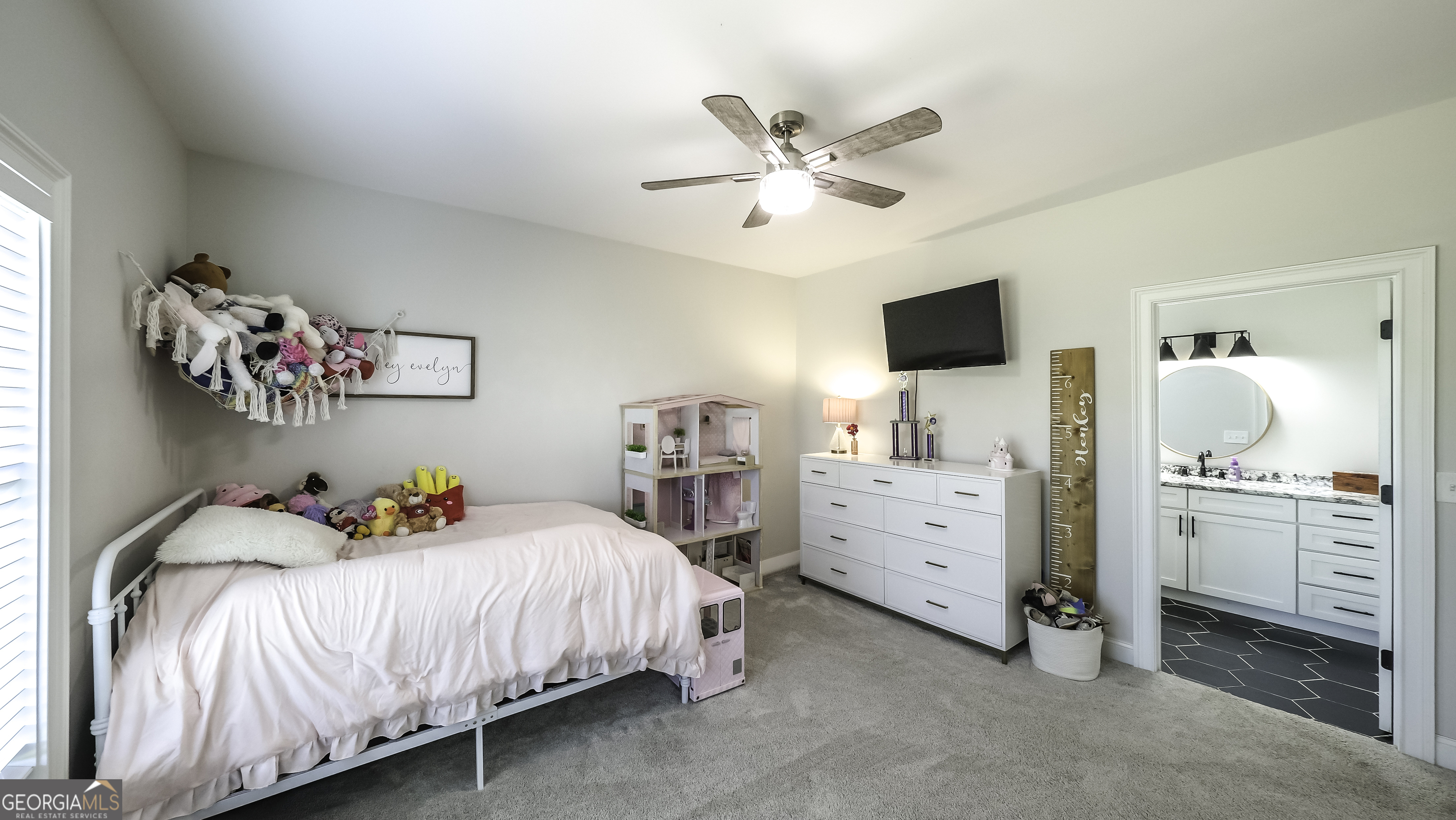 2392 Welcome Road Roopville, GA 30170 - Photo 29 of 43 a bedroom with a bed and a chandelier