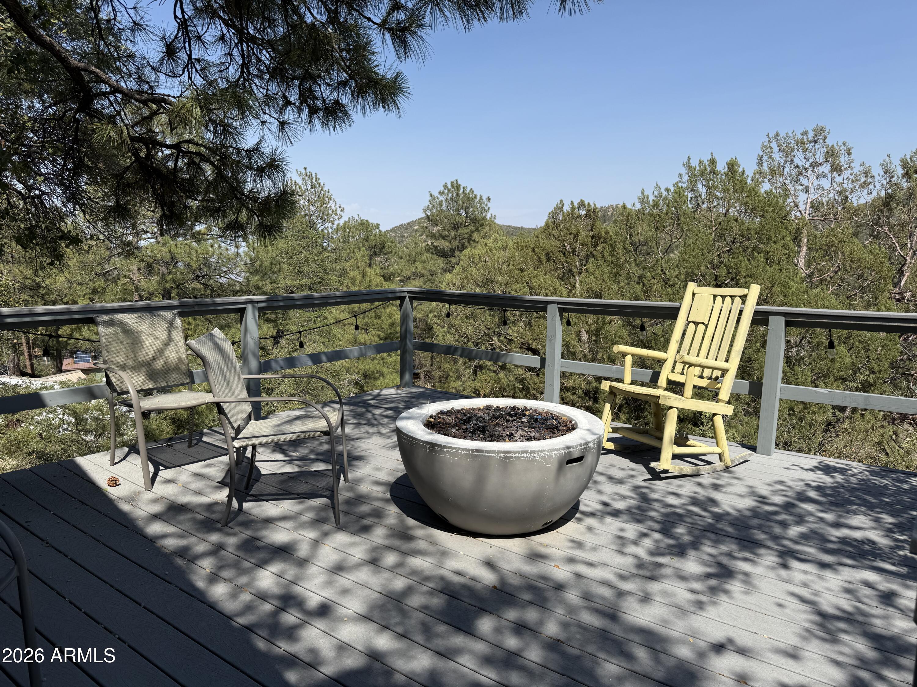 6687 Mountain View Road Crown King, AZ 86343 - Photo 5 of 18 a view of a chairs and table in the roof deck
