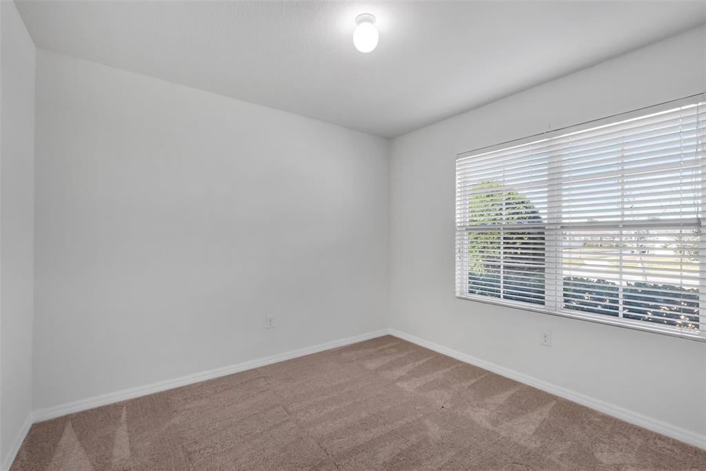 1828 Partin Terrace Road Kissimmee, FL 34744 - Photo 18 of 47 an empty room with a window