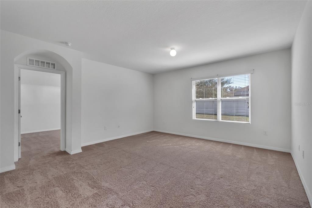 1828 Partin Terrace Road Kissimmee, FL 34744 - Photo 21 of 47 an empty room with a empty space and windows