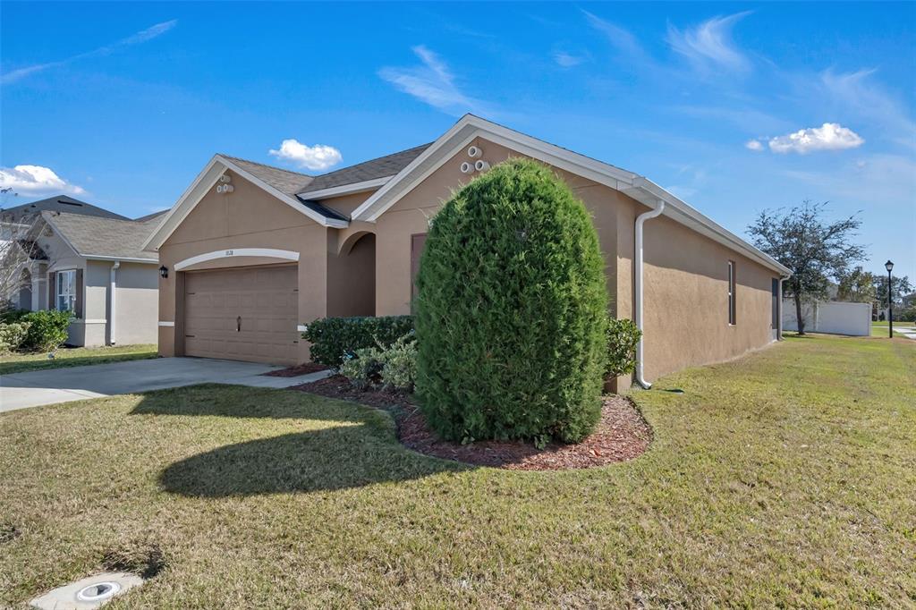 1828 Partin Terrace Road Kissimmee, FL 34744 - Photo 30 of 47 a front view of a house with garden