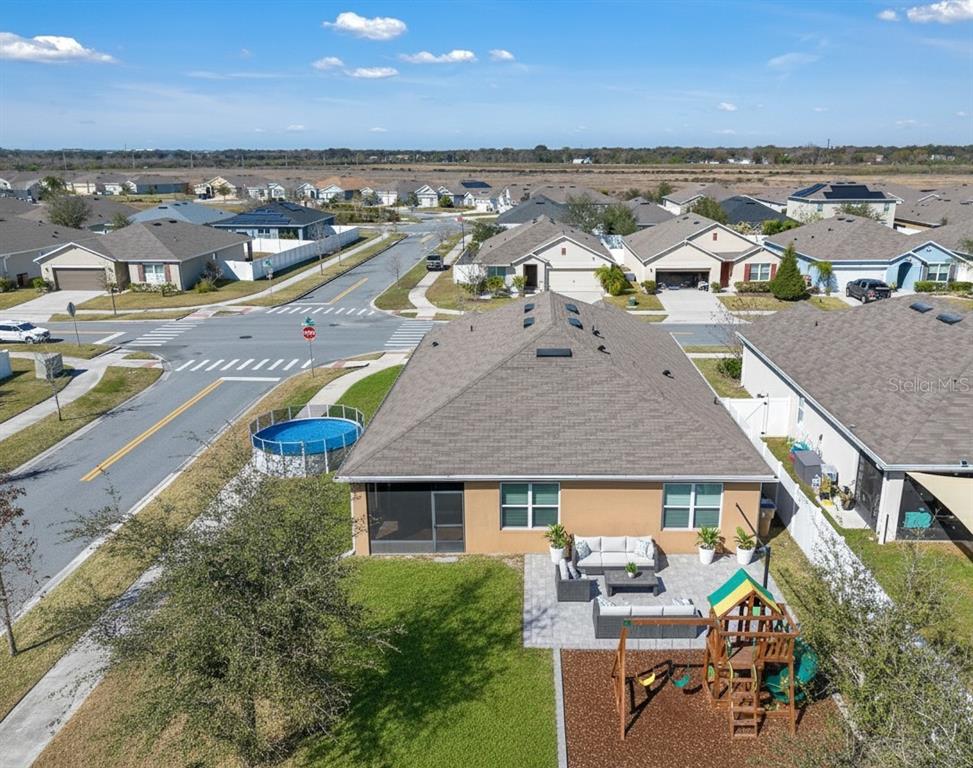 1828 Partin Terrace Road Kissimmee, FL 34744 - Photo 34 of 47 an aerial view of residential houses with outdoor space and ocean view
