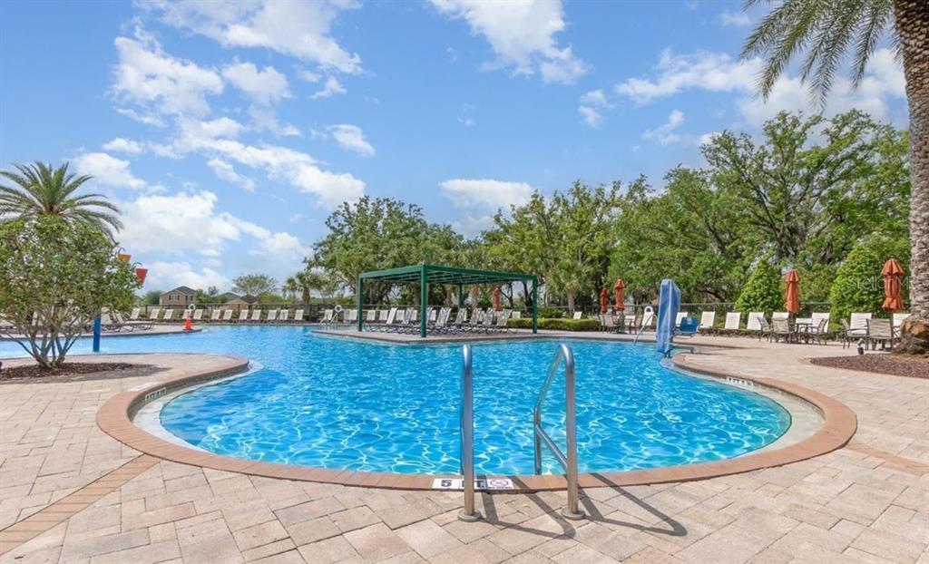 1828 Partin Terrace Road Kissimmee, FL 34744 - Photo 40 of 47 a view of a swimming pool with outdoor seating and plants
