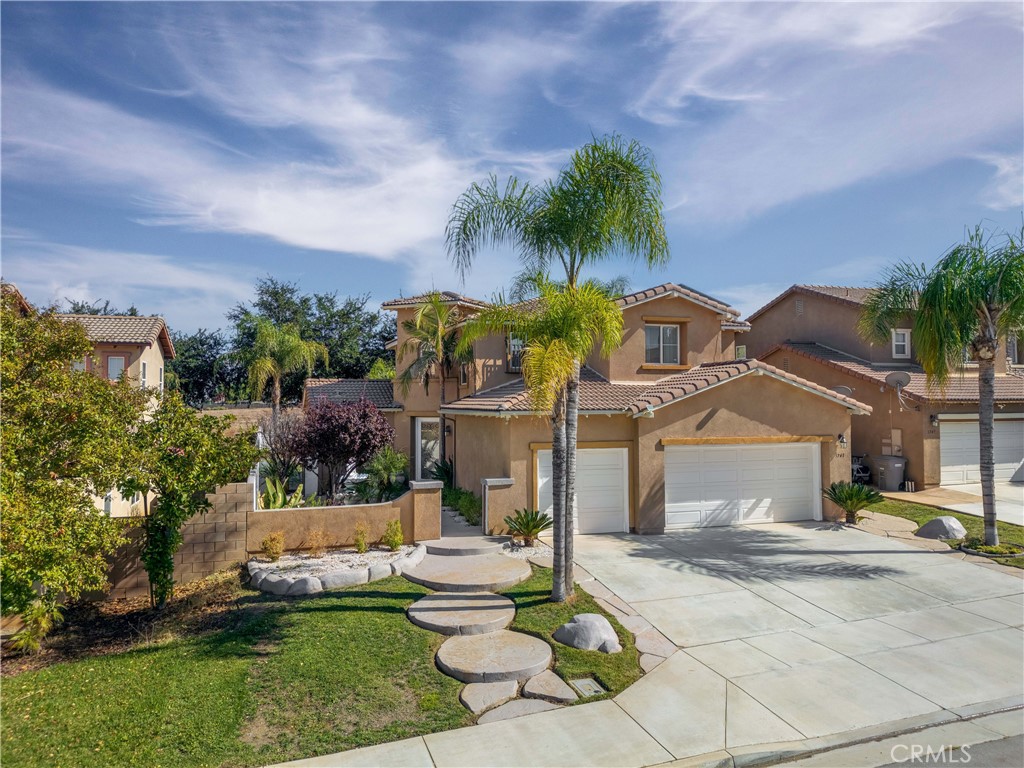 3741 Tower Perris, CA 92570 - Photo 1 of 1 a front view of a house with a yard and fountain
