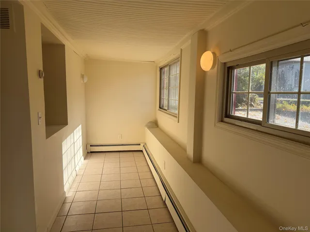 a view of an empty room and window