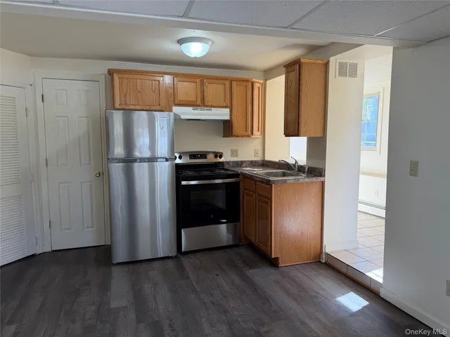 a kitchen with stainless steel appliances a refrigerator and a sink