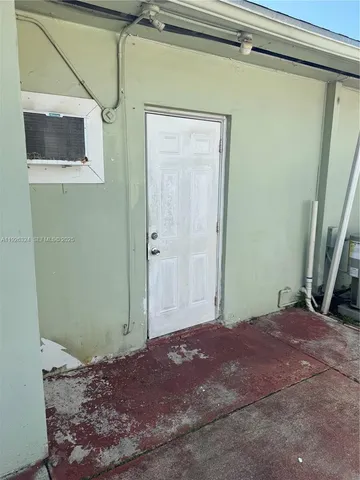 a view of a room with a front door