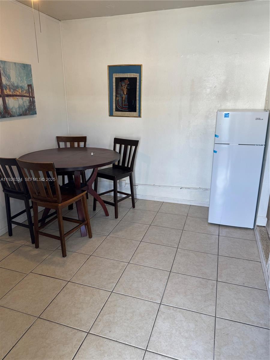 Boulevard Heights Pembroke Pines, FL 33024 - Photo 4 of 13 a view of a dining room with furniture