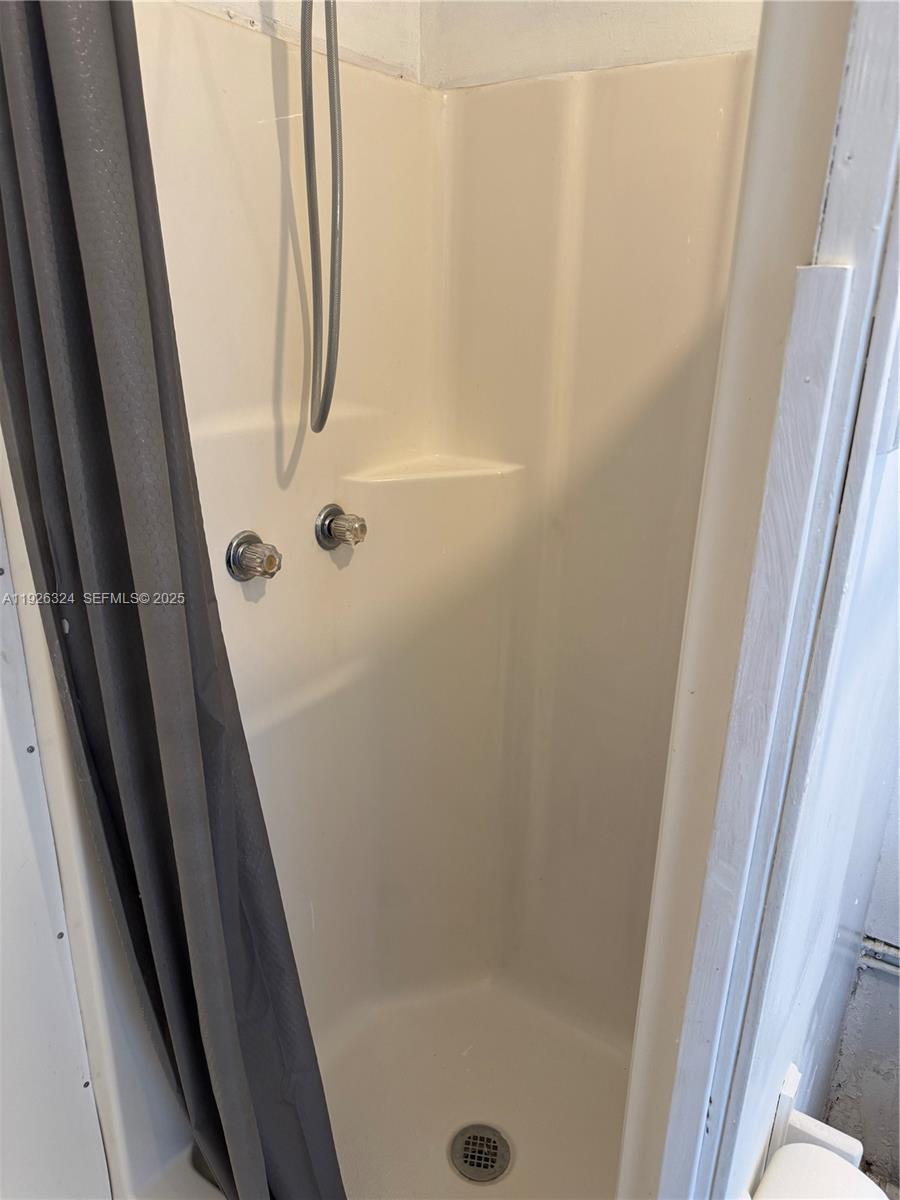 Boulevard Heights Pembroke Pines, FL 33024 - Photo 8 of 13 a bathroom with a glass door shower